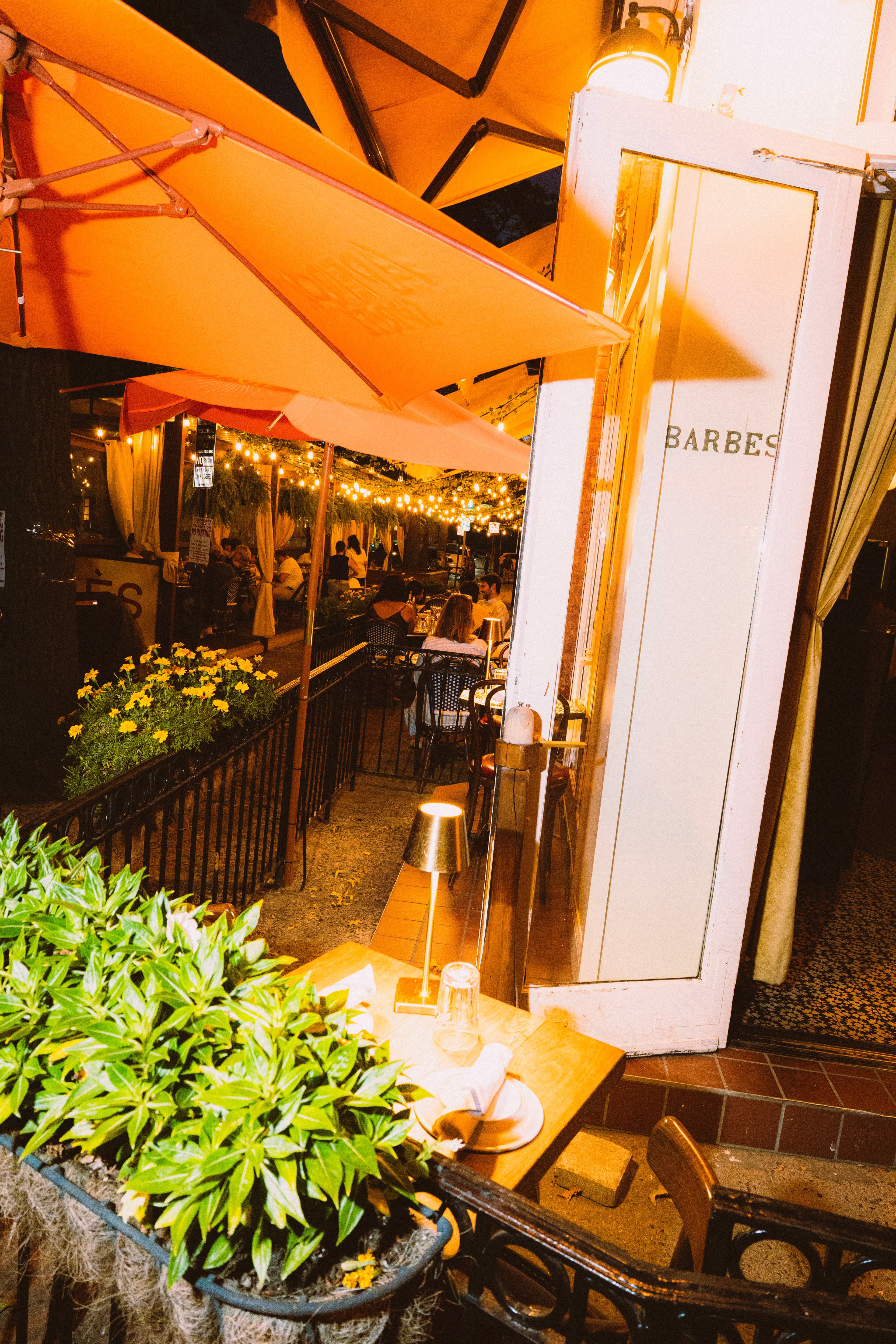 The Barbès door with the patio lit up behind it