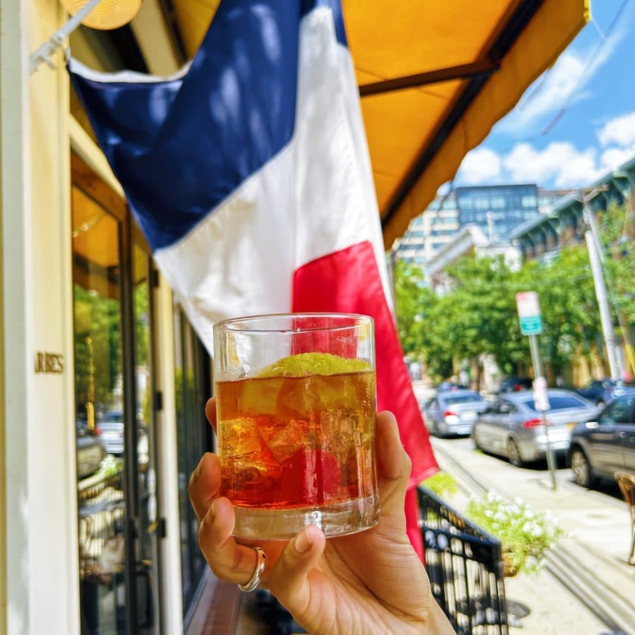 A cocktail held up outside the Barbès storefront
