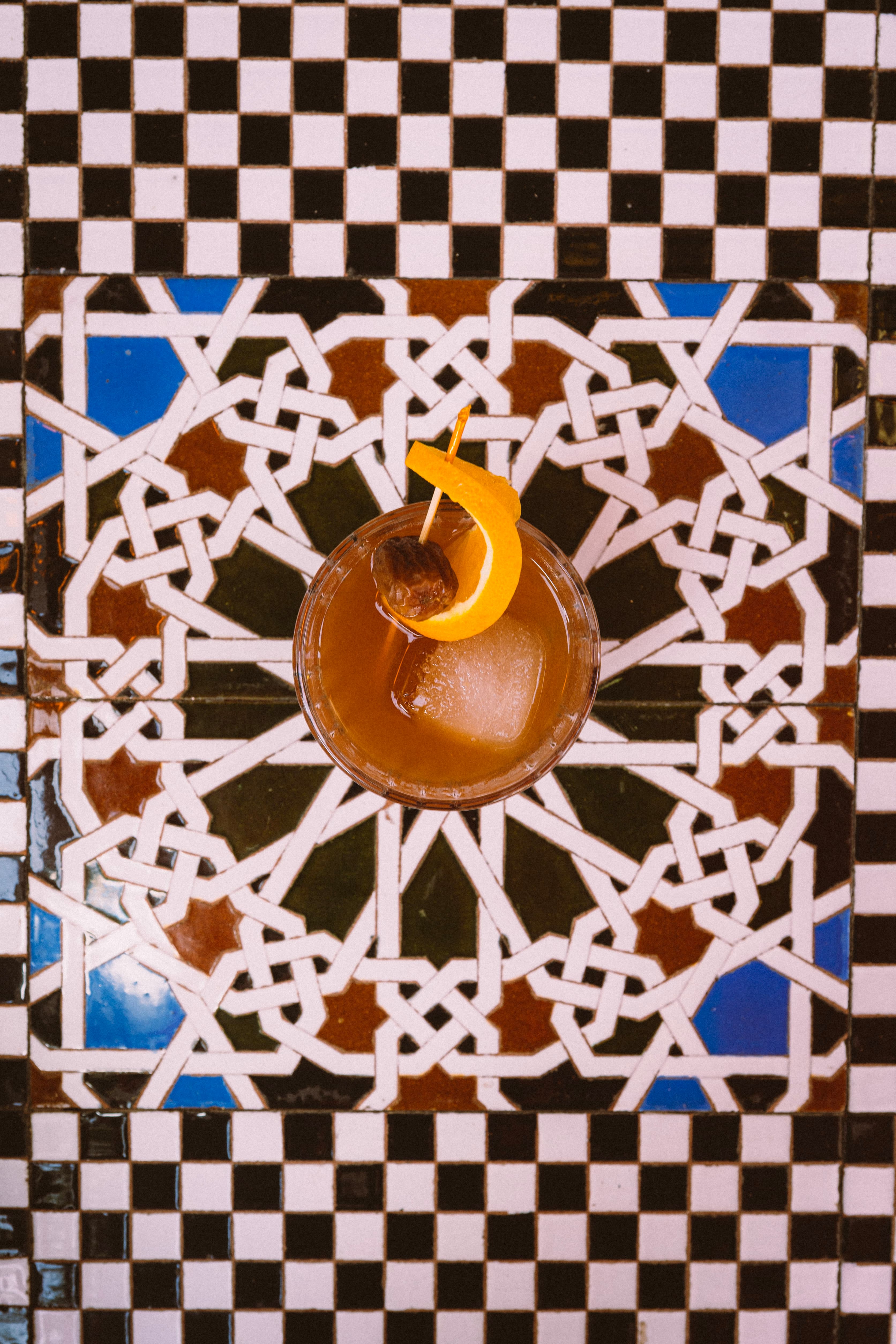 An old fashioned with an orange peel, seen from above