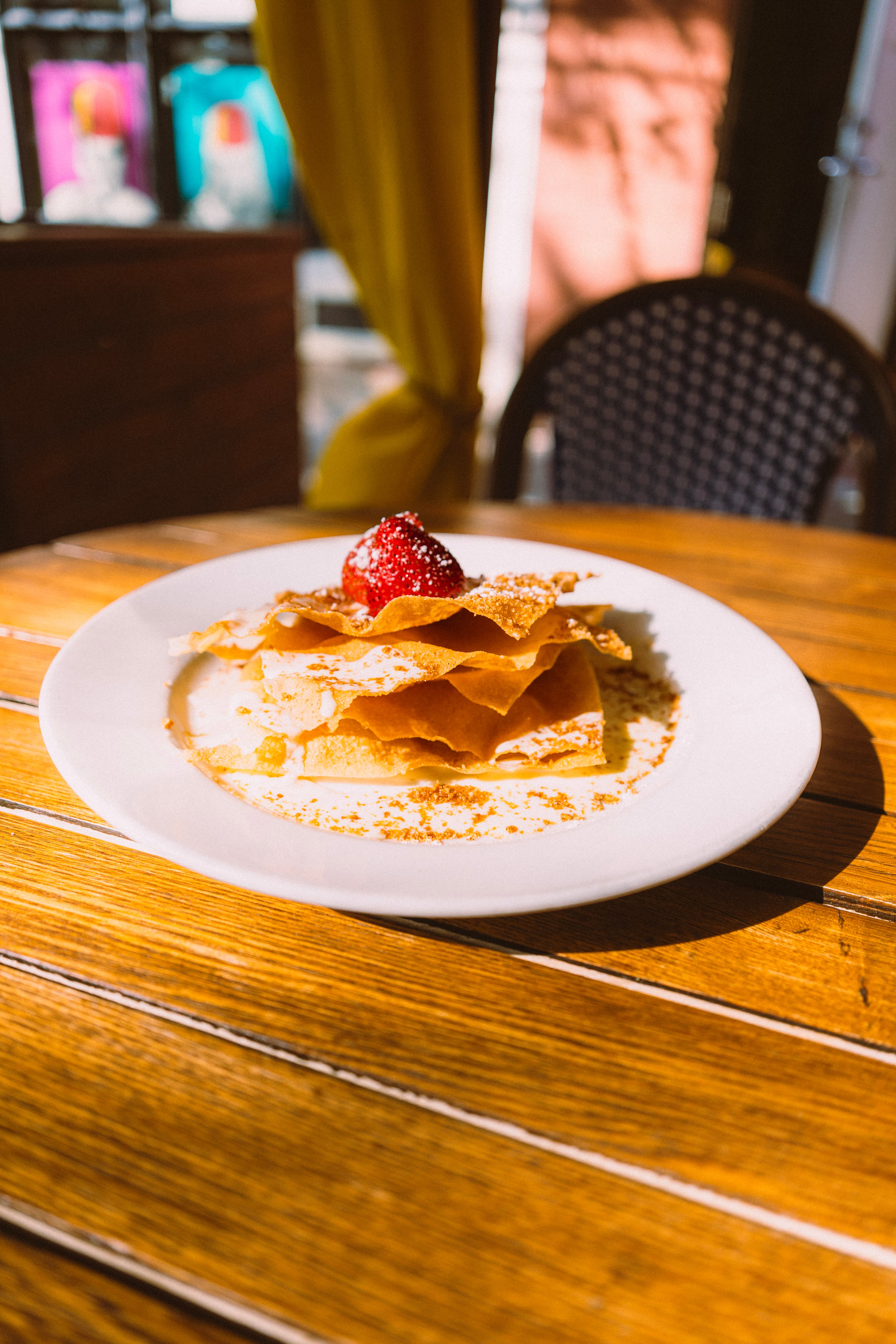 Layered phyllo pastry topped with a strawberry