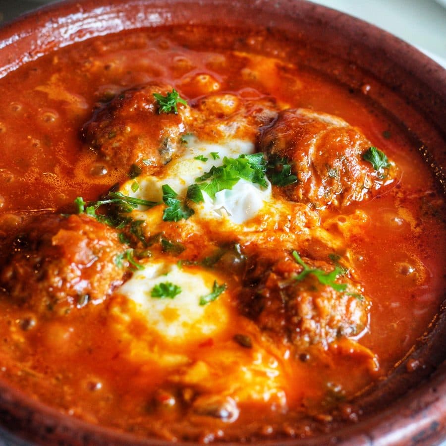 Moroccan Shakshuka, eggs cooked in tomato pepper stew